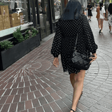 Black woven leather handbag