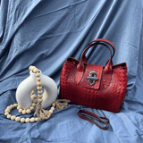 Burgundy leather tote bag styled