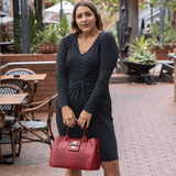 Burgundy leather tote bag modelled