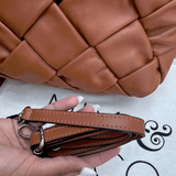 Tan woven leather bag with strap
