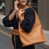 Tan leather shoulder bag on model