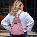 Pink leather backpack on model